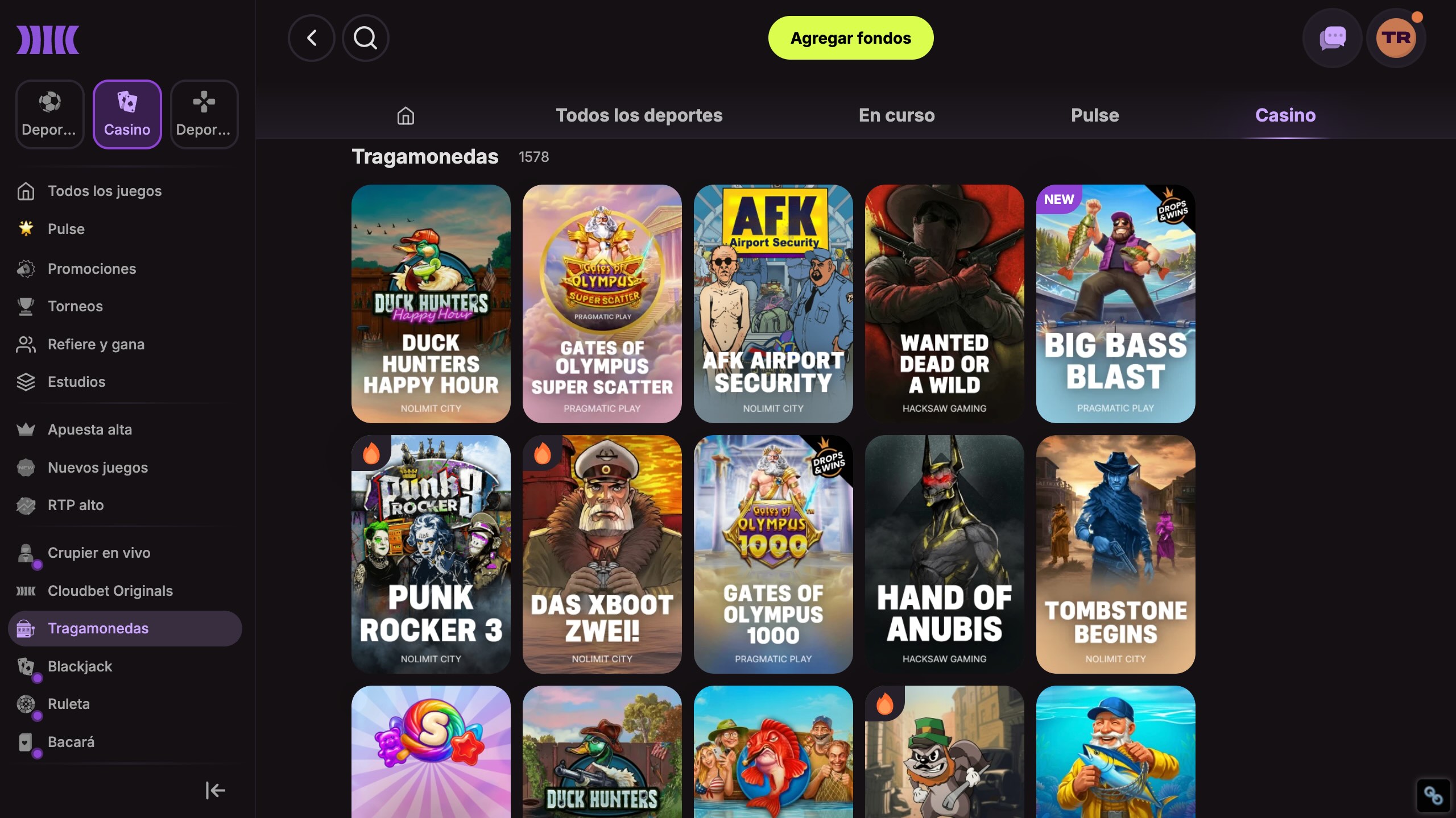 interfaz del casino cloudbet con selección de tragamonedas y menú de juegos en español