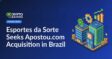 Two businesspeople shaking hands over a table with laptops and Brazilian flag on a digital screen behind them.